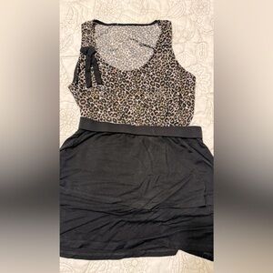 Black skirt, soft fabric, nice texture. With leopard top. Silk